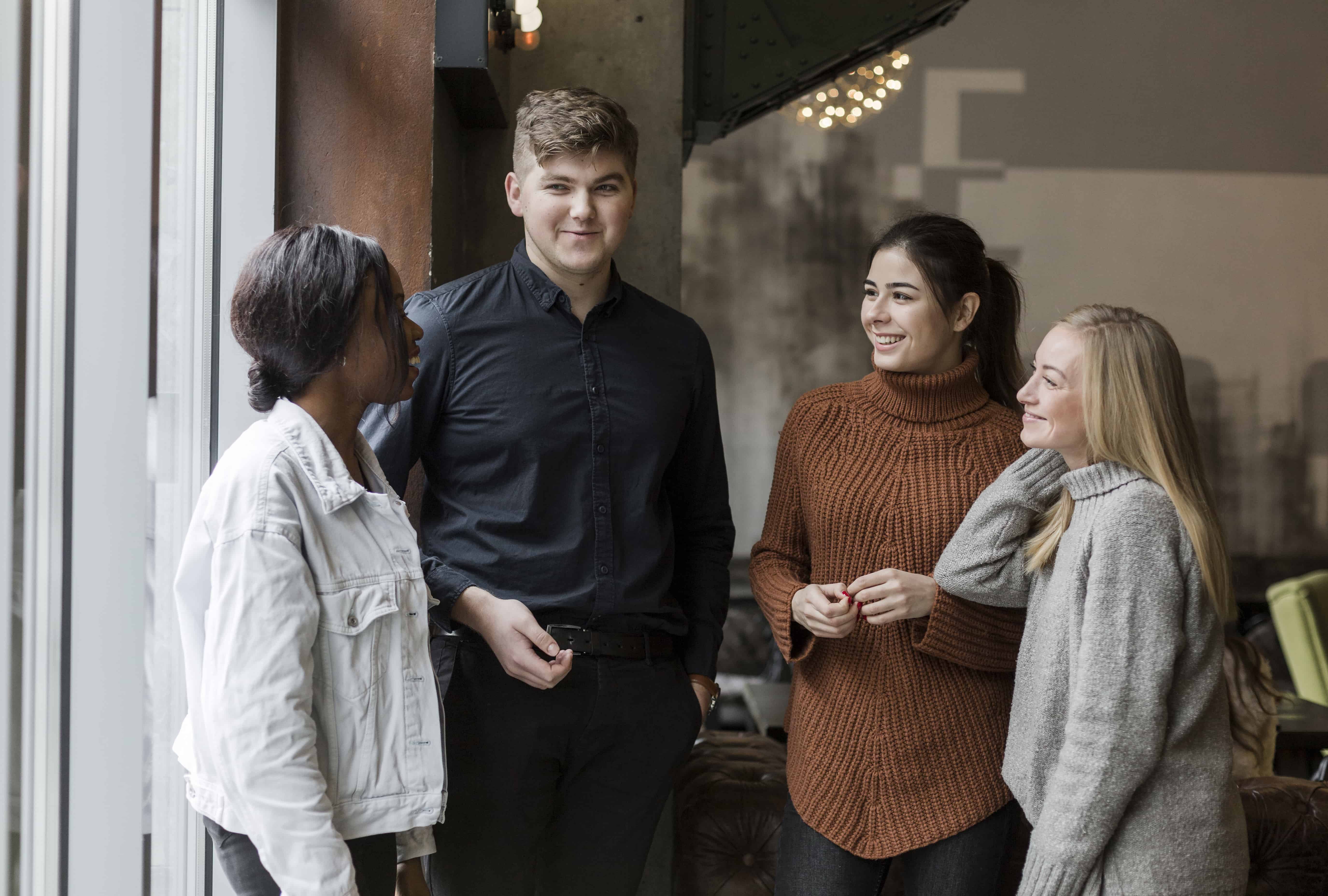 group-young-friends-talking-each-other